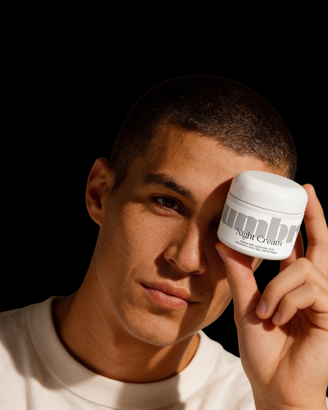 Man holding slumbrr Night Cream jar