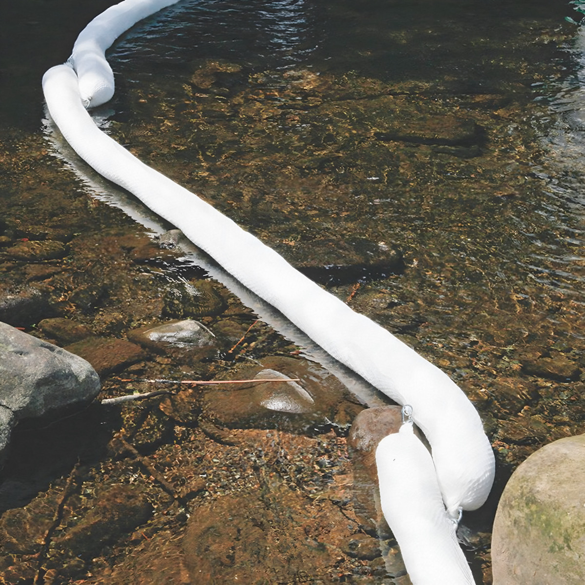 Absorbent boom deployed in a stream for spill containment — AbsorbentsOnline.com